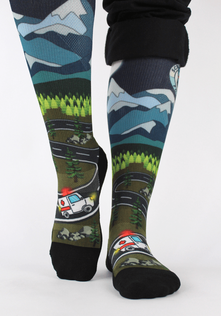 Compression socks for nurses, midnight design with ambulance, front view showing 20-30mmHg compression.