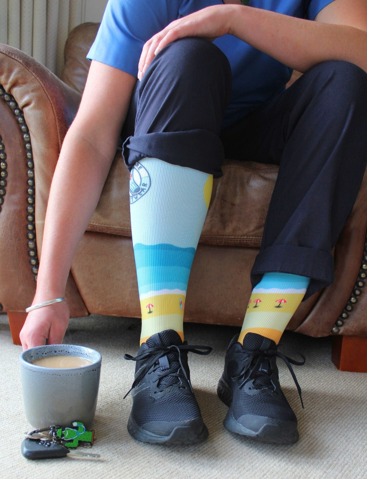 Lifestyle shot of Scrubcare Footwear's beach style nursing socks.