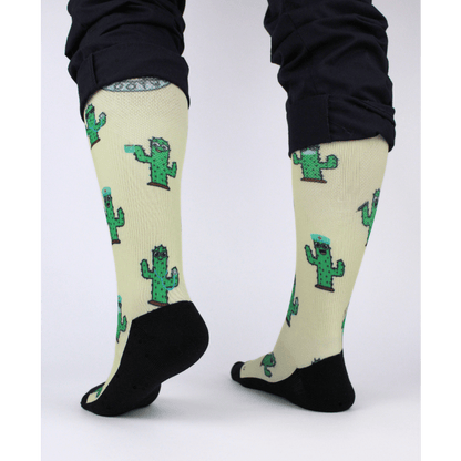 Compression socks for nurses with a cactus design, rear view of socks showing padding in the heel.