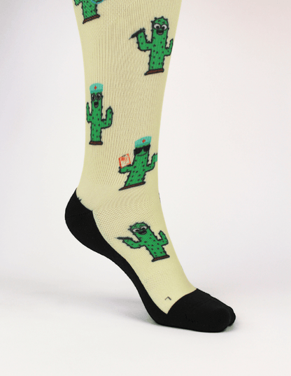 Compression socks for nurses with a cactus design, close up view of socks showing breathable material.