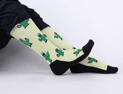 Compression socks for nurses with a cactus design, landscape view of whole socks on legs.