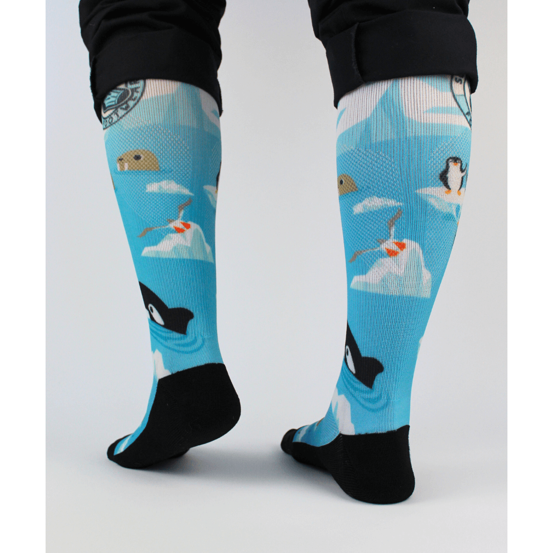 Compression socks for nurses with a polar theme, back view showing padding in the sole.