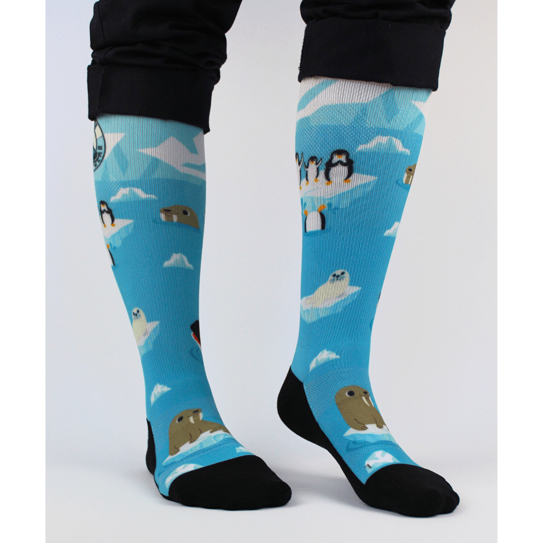 Compression socks for nurses with a polar theme, front view with feet angled right.